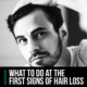 Man checking hairline for hair loss